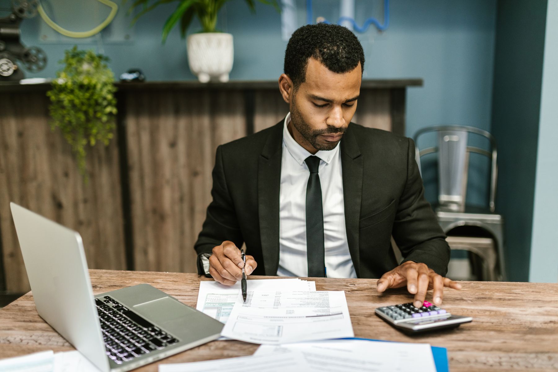 Financial documents and a calculator on a desk
